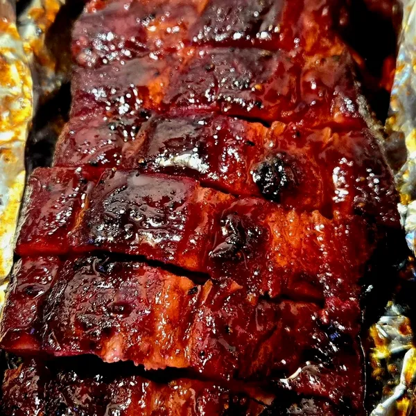 Pork belly burnt ends glazed and glistening straight off the smoker
