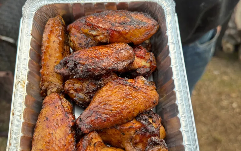 Sliced smoked chicken finished with a creamy sauce drizzle